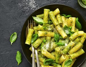 plate of basil sauce on pasta