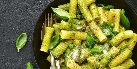 plate of basil sauce on pasta