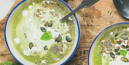 two bowls of green pea soup