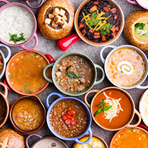 variety of soups and sauces in colorful bowls