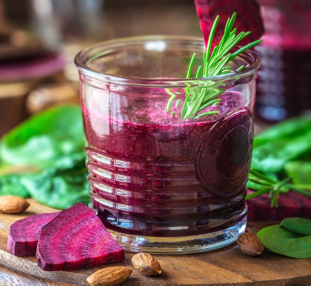 glass of bright purple beet juice